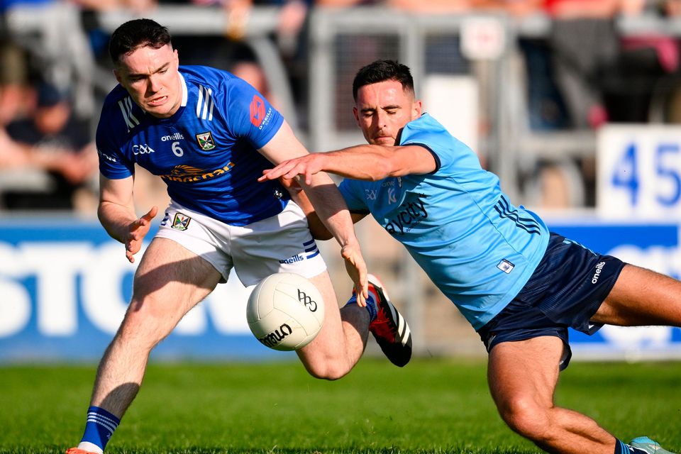 Niall Carolan of Cavan in action against Niall Scully of Dublin during the All-Ireland SFC round 2 match at Kingspan Breffni in Cavan. Photo: Ramsey Cardy/Sportsfile