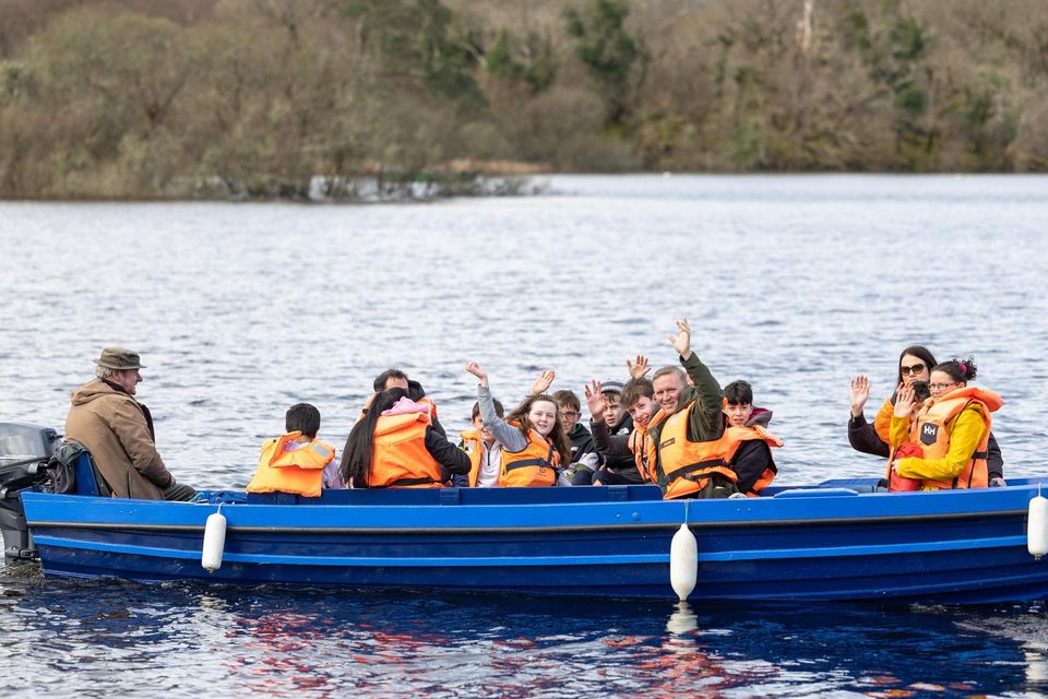 Students of Gaelscoil Faithleann with their parents departing from Ross Castle to the Innisfallen Island for a Mass and Farewell event to celebrate the retirement of Proinsias Mac Curtain Principal of Gaelscoil Faithleann. Photo by Tatyana McGough