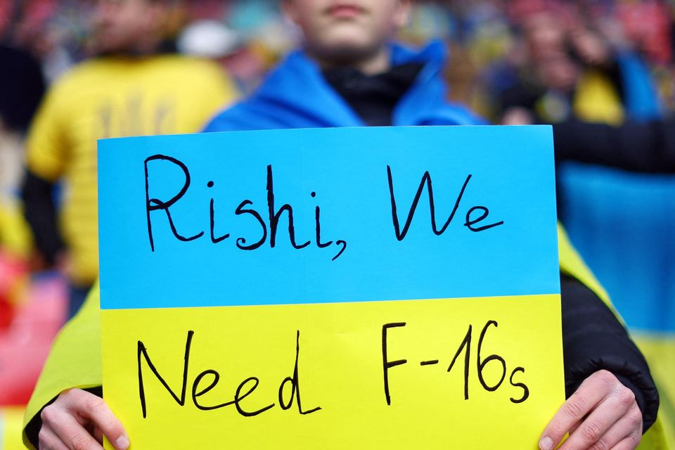 A Ukraine fan holds up a banner during his country's match against England in a European Championship qualifier at Wembley. Photo: Carl Recine/Reuters