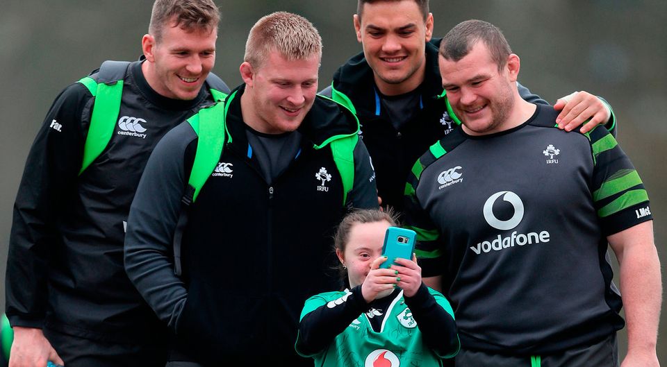 Rugby fan Jennifer Malone snapped a selfie with some of her heroes at the Irish training camp yesterday. Joe Schmidt’s men are gearing up for the challenge of Wales in the Aviva Stadium tomorrow and they took some time out to mingle with supporters. Six Nations debutant Chris Farrell, John Ryan, Quinn Roux and Jack McGrath stopped to pose for a photo with Jennifer at Carton House, Co Kildare. The invasion of Welsh fans has already begun and thousands will make the short journey across the Irish Sea for the clash. Photo: Brian Lawless/PA Wire