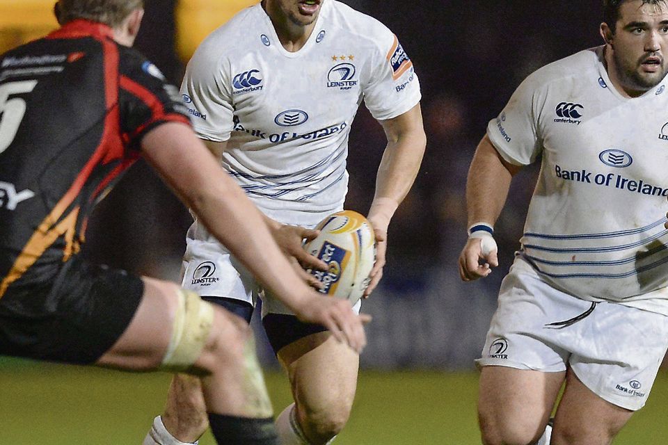 FULL DEBUT: Leinster’s Zane Kirchner, with Martin Moore in support, takes on Matthew Screech of the Newport-Gwent Dragons during their PRO12 match at Rodney Parade last night.