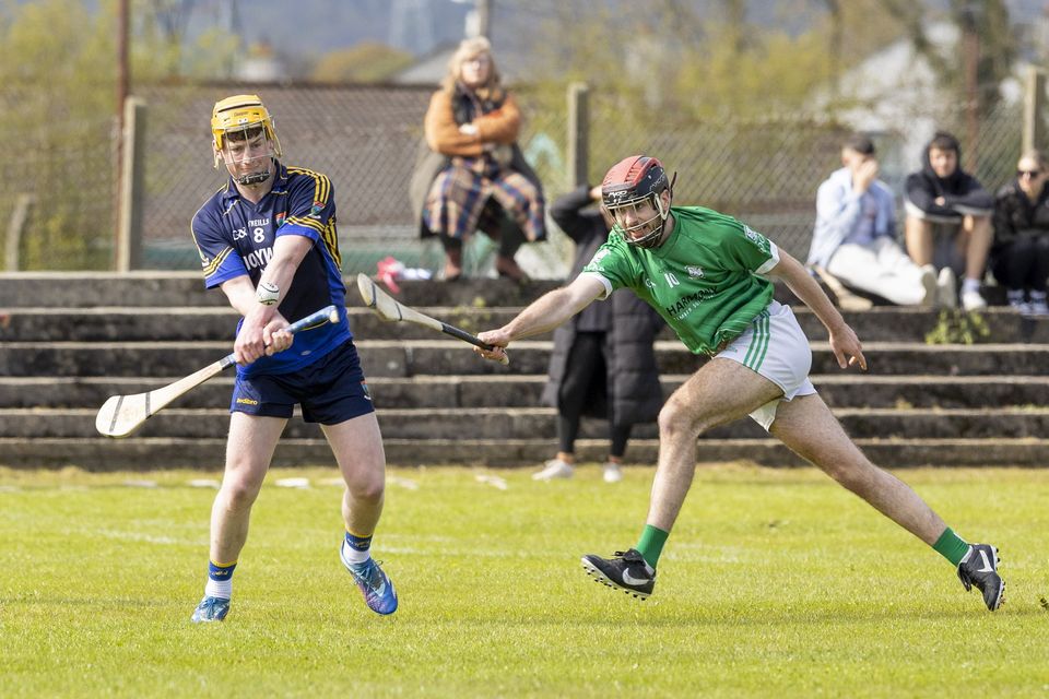 Luke Byrne of Western Gaels takes a long-range shot while being closed down by Conor Jameson of Arklow Rocks.