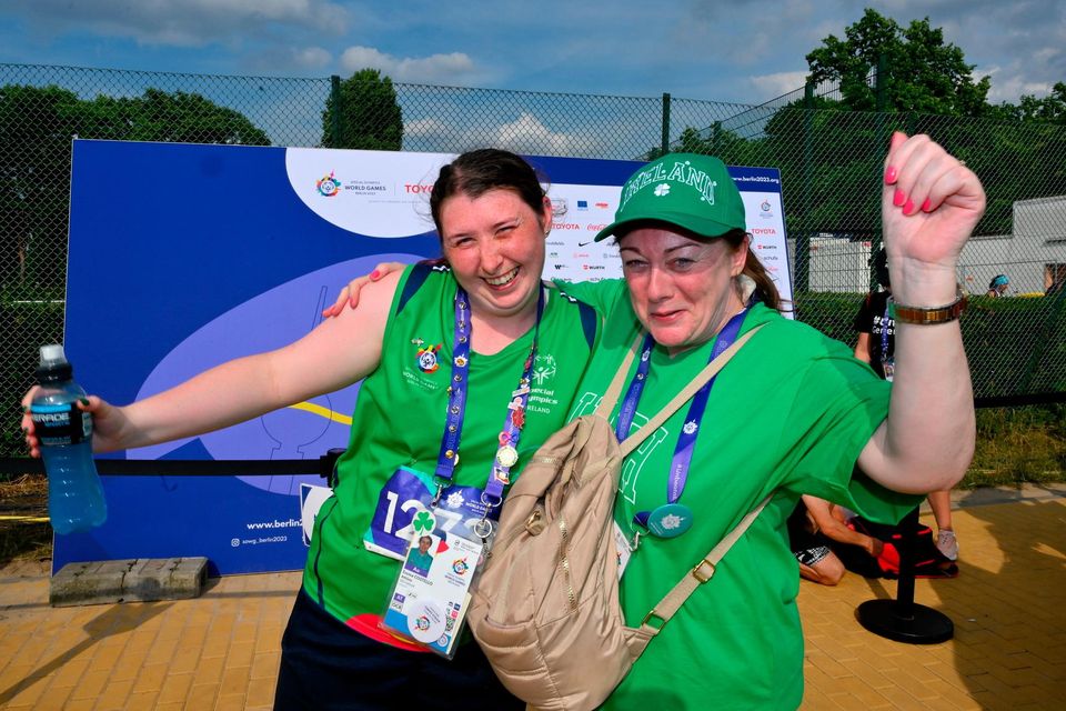 Team Ireland's Emma Costello, a member of Navan Special Olympics Club, from Clonee, Dublin, with her mother Siobhán after competing in the Long Jump qualifying round on day five of the World Special Olympic Games 2023 at the Hanns-Braun-Stadion, in the Olympiapark, Berlin, Germany.  Photo by Ray McManus/Sportsfile
