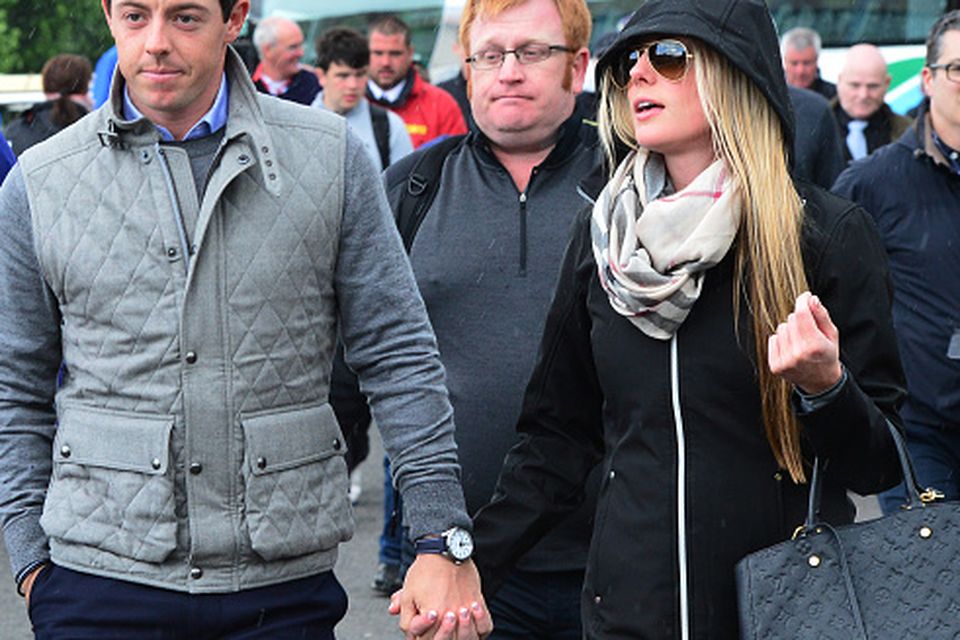 Rory McIlroy of Northern Ireland arrives at the course with new girlfriend Erica Stoll during the fourth round of the Dubai Duty Free Irish Open hosted by the Rory Foundation at Royal County Down Golf Club on May 31, 2015 in Newcastle, Northern Ireland. (Photo by Mark Runnacles/Getty Images)