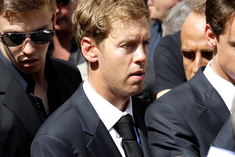 German Formula One driver Sebastian Vettel attends the funeral of French Formula One driver Jules Bianchi at the Sainte Reparate Cathedral during in Nice, French Riviera, Tuesday, July 21, 2015. Bianchi, 25, died Friday from head injuries sustained in a crash at last year's Japanese Grand Prix. He had been in a coma since the Oct. 5 accident, in which he collided at high speed with a mobile crane which was being used to pick up another crashed car. (AP Photo/Lionel Cironneau)