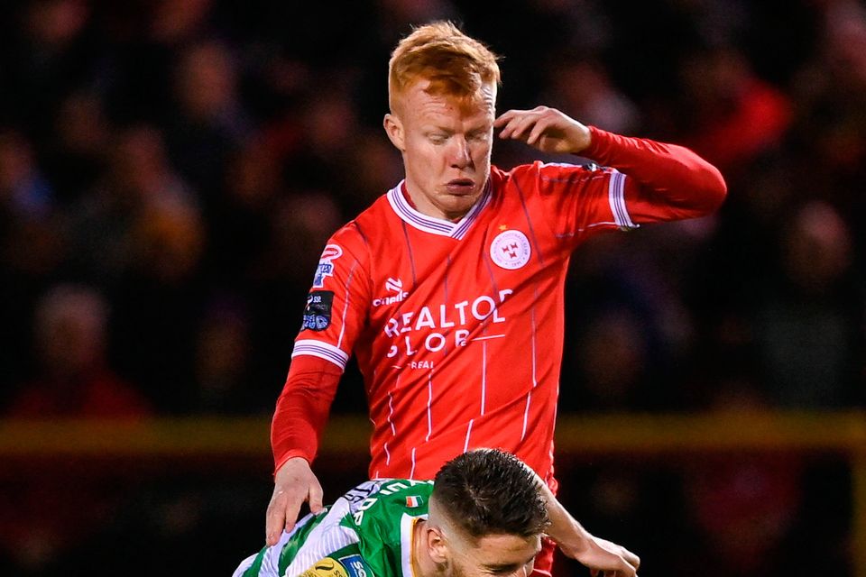 Shane Farrell of Shelbourne tackles Dylan Watts of Shamrock Rovers during the SSE Airtricity Premier Division match at Tolka Park