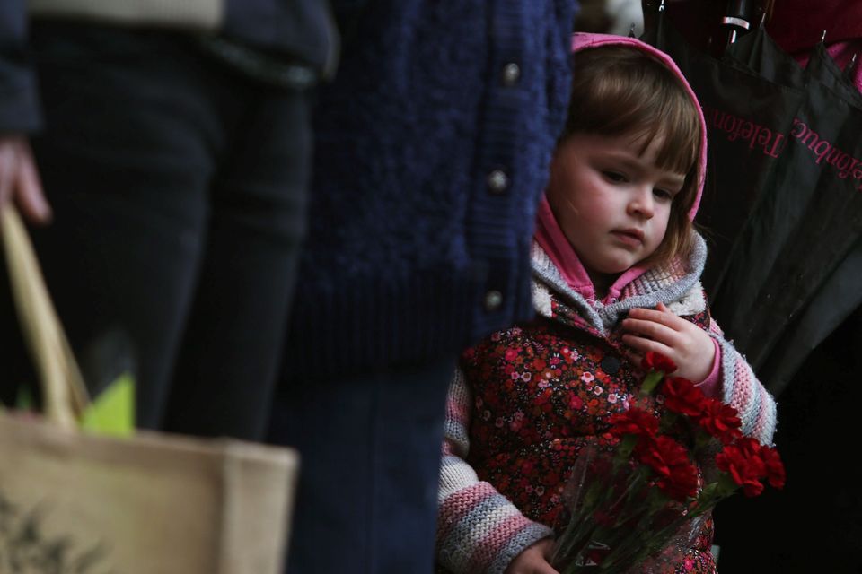 Ciara O'Connor (3) at the third annual Flowers for Magdalenes remembrance event in Glasnevin cemetery, Dublin, to mark all of the women incarcerated in the Magdalene laundries. Photo: Brian Lawless/PA Wire