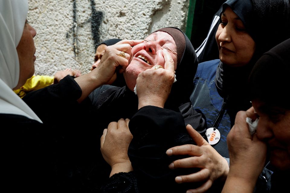 The mother of one of three Palestinian militants killed in an Israeli raid, weeps during their funeral in Balata refugee camp in Nablus. Photo: Reuters