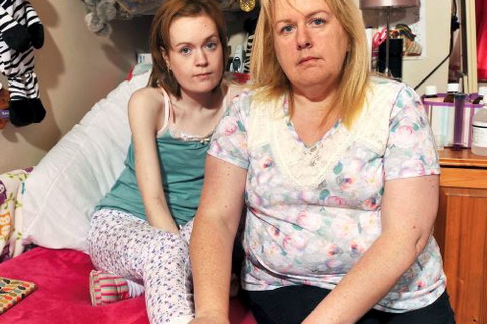 Lauren Walsh, aged 24, pictured with her mother Callie in their family home in Passage West, Cork.