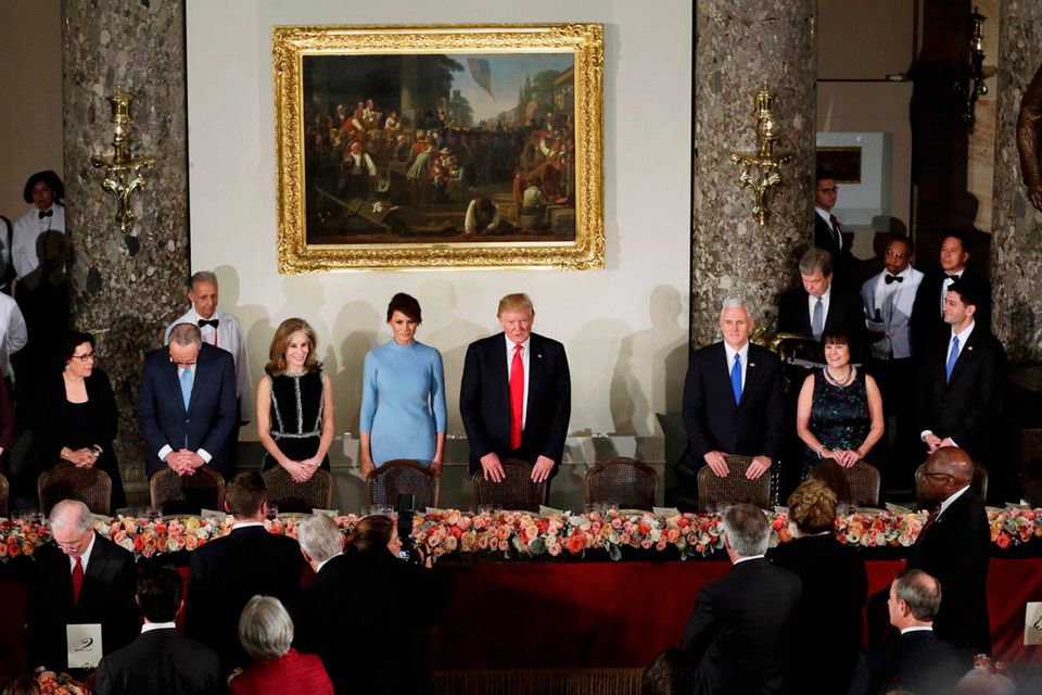 U.S. President Donald Trump and first lady Melania stand with Vice President Mike Pence and his wife Karen Pence during the Inaugural luncheon at the National Statuary Hall in Washington, U.S, January 20, 2017.  REUTERS/Yuri Gripas