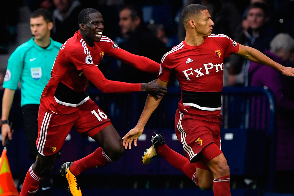 Richarlison celebrates scoring his side's second goal with his team mate Abdoulaye Doucoure. Photo: Getty Images