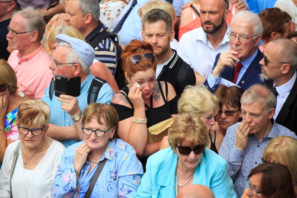 Mourners at the funeral of Brendan Grace in the Liberties in Dublin.
(Photo: Mark Condren)