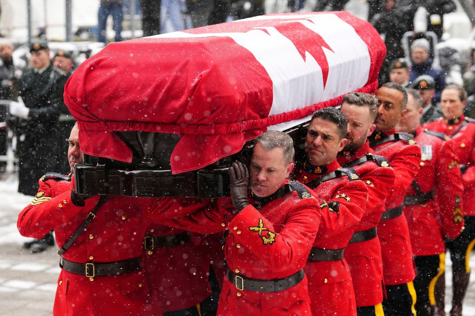 Pallbearers carry the coffin of Brian Mulroney in Montreal yesterday. Photo: AP