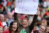 thumbnail: Mayo supporters Nuala Connolly, centre, from Kilmaine, and her friends Laura Muldoon, from Mulranny, and Hanna Callaghan, from Achil, send good wishes to their mother's from the Davin stand of Croke Park.