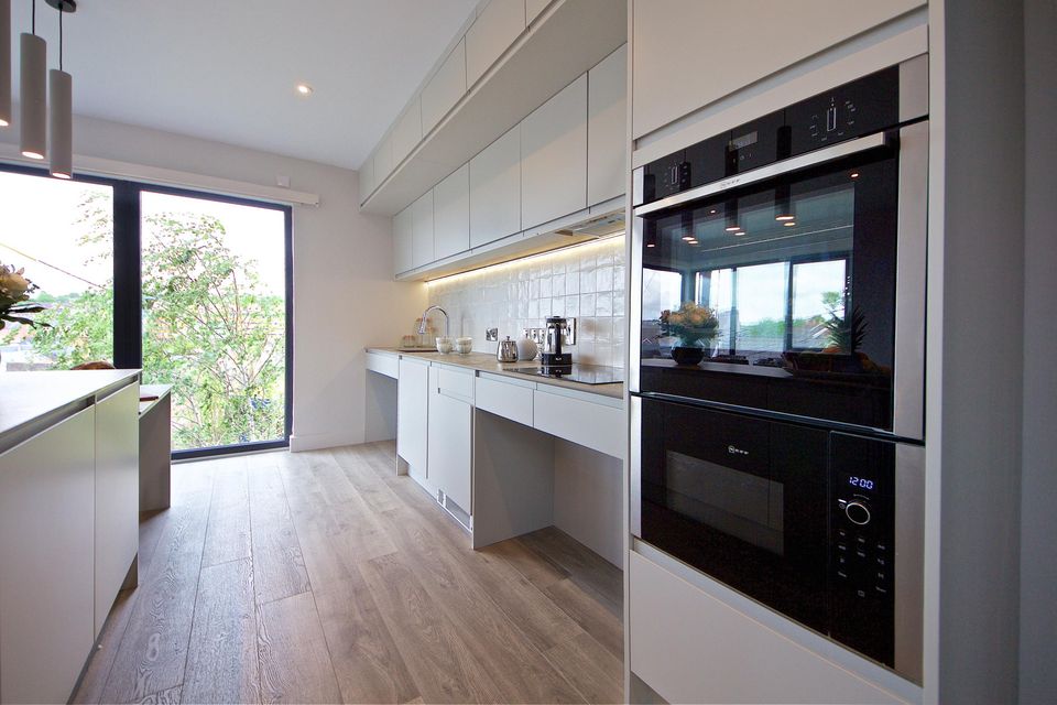 The kitchen which features top of the range Neff appliances.