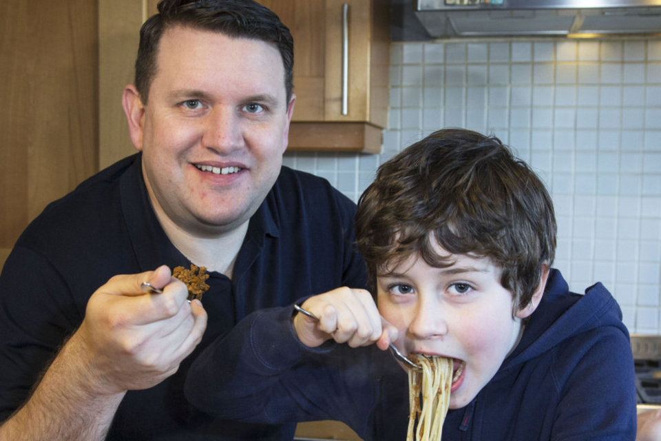 Portion control: Alex Meehan and his son Sam (7) eat spaghetti Bolognese as they test the 400-600-600 diet. Photo: Colin O'Riordan