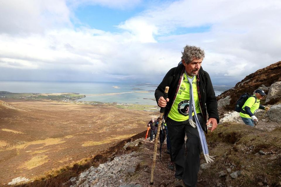Charlie Bird makes his way to the top of Croagh Patrick. Picture by Gerry Mooney.