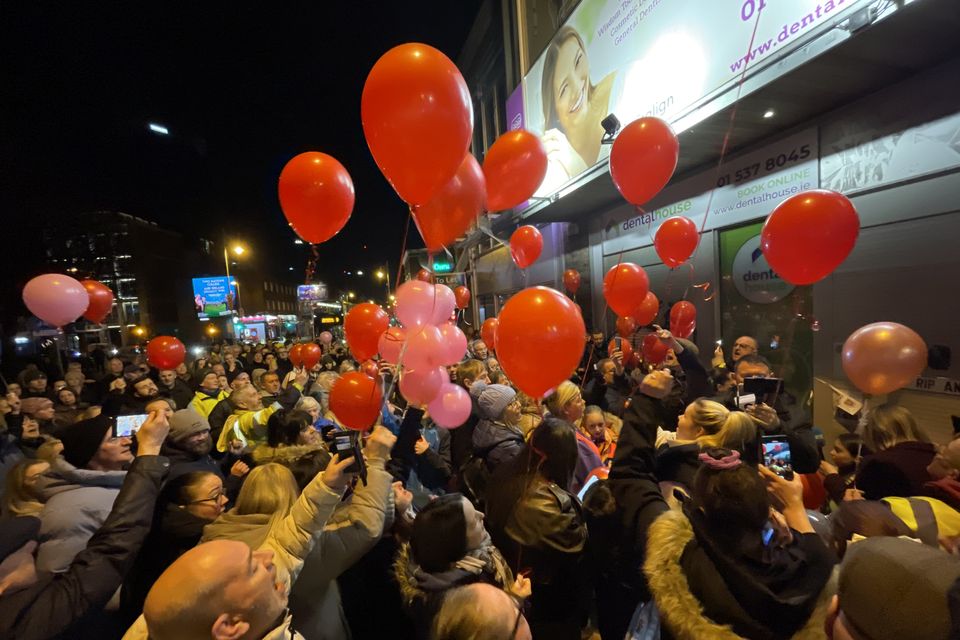 People release balloons at the spot on Aungier Street, Dublin, where Ann Delaney usually sat. Photo: RollingNews.ie