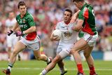 thumbnail: Mark Donnelly, Tyrone, in action against Enda Varley, left, and Seamus O'Shea