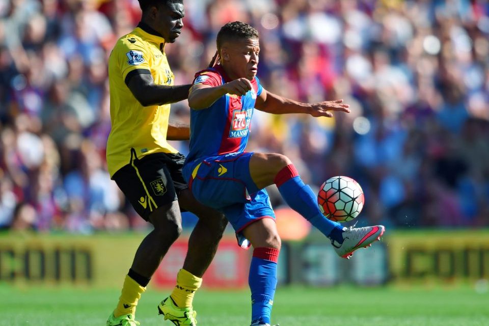 Crystal Palace's Dwight Gayle attempts to control the ball ahead of Micah Richards