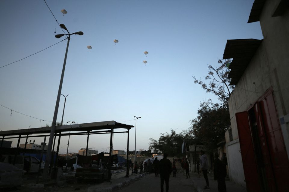 U.S. military carry out its first aid over Gaza, amid the ongoing the conflict between Israel and the Palestinian Islamist group Hamas, in Gaza City. REUTERS/Kosay Al Nemer
