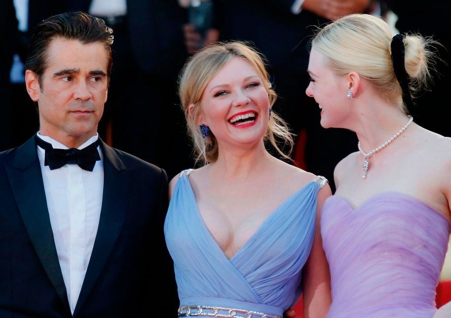 Cast members Colin Farrell, Kirsten Dunst and Elle Fanning and pose at the 70th Cannes Film Festival