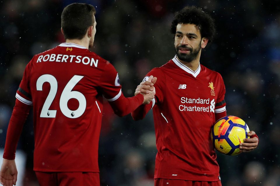 Mohamed Salah celebrates his hat-trick with Andy Robertson in Saturday’s win over Watford
