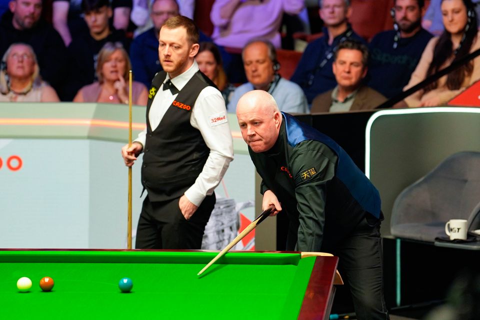 Mark Allen and John Higgins in the World Snooker Championship. Photo: PA