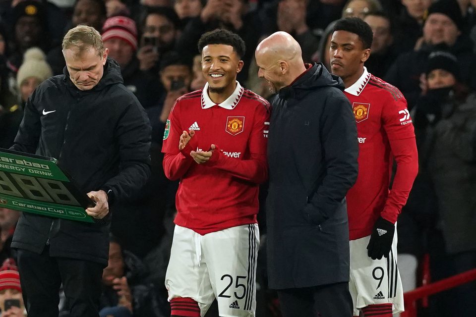 Manchester United’s Jadon Sancho with manager Erik ten Hag as he comes off the bench to make a substitute appearance during the Carabao Cup semi-final, second leg match at Old Trafford, Manchester. Picture date: Wednesday February 1, 2023.