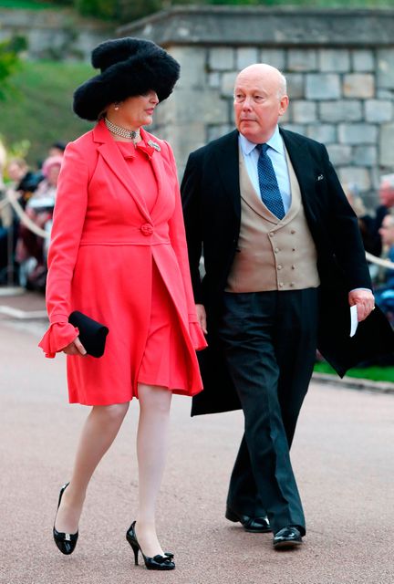 Emma Joy Kitchener and Julian Fellowes arrive at the grounds of Windsor Castle during the wedding of Princess Eugenie to Jack Brooksbank at St George's Chapel in Windsor Castle