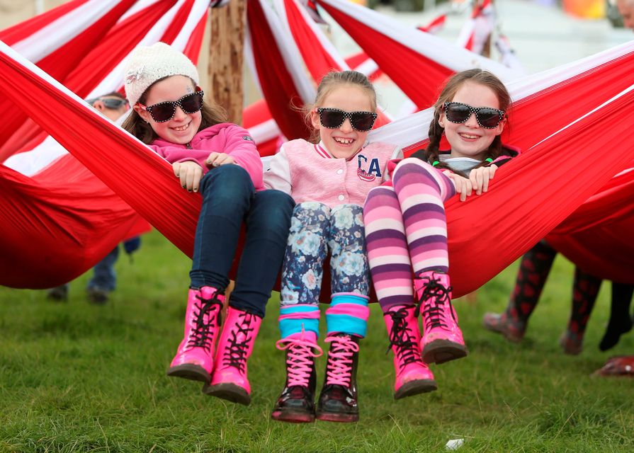 From l to r are, Cousins, Mairead O'Byrne, 9, Ellen O'Byrne, 8, and Aoife McEvoy, 9, from Rathineska, Laois relaxing at the last day of the Electric Picnic Music Festival at Stradbally, Co. Laois. Picture credit; Damien Eagers 31/8/2014