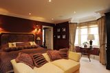 thumbnail: The master bedroom with panoramic views of the River Deben through
the bay window.