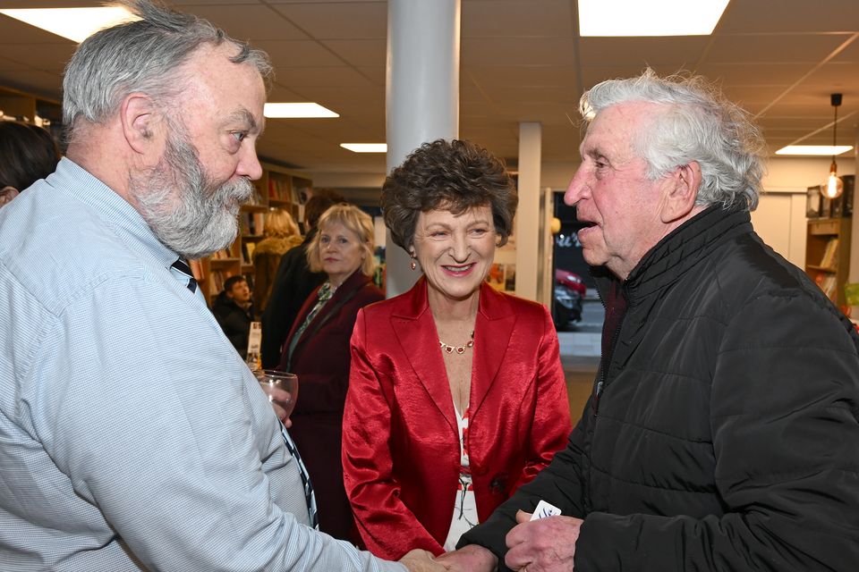 Michael Stewart is welcomed by Padraig McGovern and Susan McGovern to the launch of Susan's latest book 'The She Team Does Lockdown' held in Roe River Books. Photo by Ken Finegan/Newspics Photography