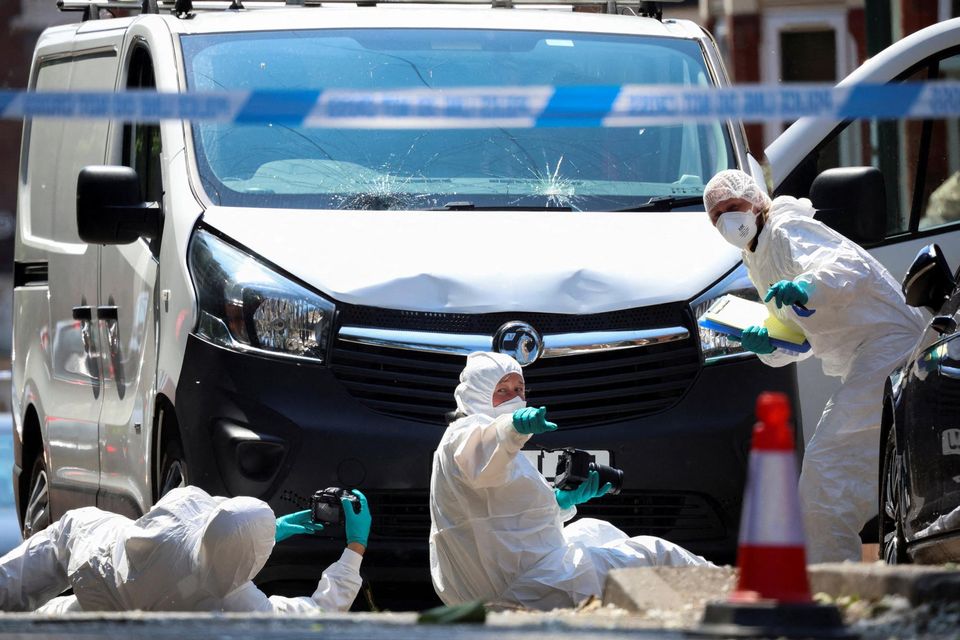 Police forensic officers work near a van in a cordon on the Bentinck Road following a major incident in Nottingham city centre. Reuters