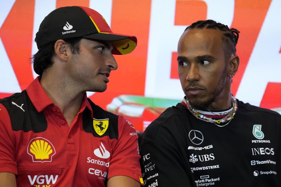 Lewis Hamilton (right) – speaking to current Ferrari driver Carlos Sainz – is out of contract at the end of the year with rumours linking him with a move to the Scuderia for next season Photo by Sergei Grits/AP