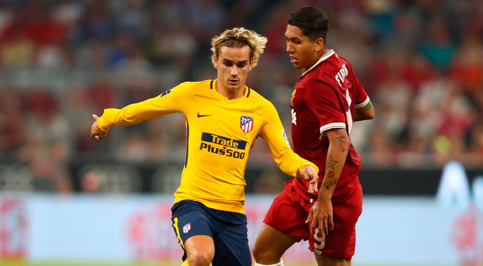 Liverpool's Roberto Firmino in action with Atletico Madrid's Antoine Griezmann. Photo: Reuters/Michael Dalder