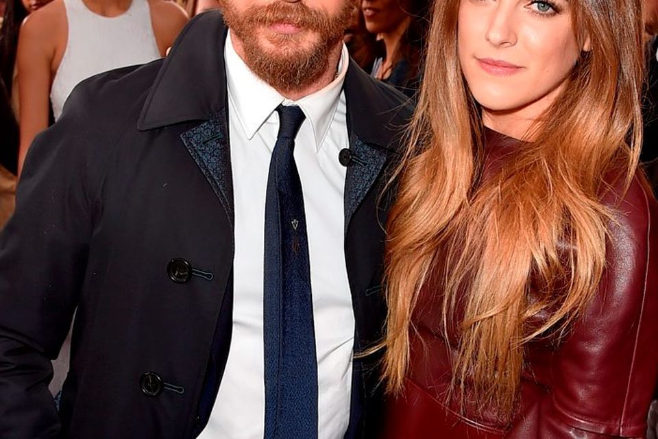 Actors Tom Hardy (L) and Riley Keough attend the premiere of Warner Bros. Pictures' "Mad Max: Fury Road" at TCL Chinese Theatre on May 7, 2015 in Hollywood, California.  (Photo by Kevin Winter/Getty Images)