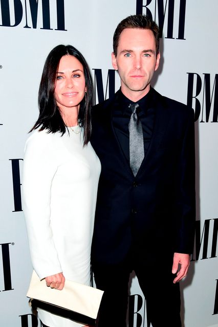 Actress Courteney Cox (L) and musician Johnny McDaid of Snow Patrol attend The 64th Annual BMI Pop Awards, honoring Taylor Swift and songwriting duo Mann & Weil, at the Beverly Wilshire Four Seasons Hotel on May 10, 2016 in Beverly Hills, California.  (Photo by Frazer Harrison/Getty Images for BMI)