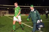 thumbnail: 18 November 1998; Ireland captain Roy Keane leaves the field with Charlie O'Leary, Equipment Officer, following the UEFA Euro 2000 Group 8 Qualifier between Yugoslavia and Republic of Ireland at the Red Star Stadium, in Belgrade, Yugoslavia. Photo by David Maher/Sportsfile