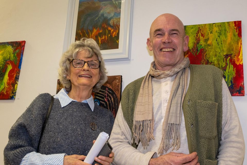 Greg Murray with artist Mary Brandon and one of her pieces, 'Volcano', behind.