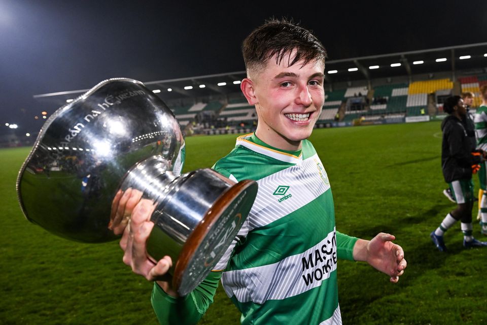 Cian Barrett with the President's Cup. Photo by Stephen McCarthy/Sportsfile