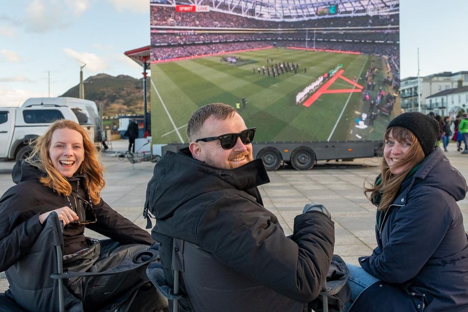 Leonie Schaal, Brian Howard and Dilia Eckert watching the Ireland v England rugby match in Bray.