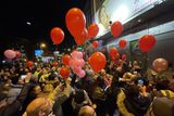 thumbnail: People release balloons at the spot on Aungier Street, Dublin, where Ann Delaney usually sat. Photo: RollingNews.ie