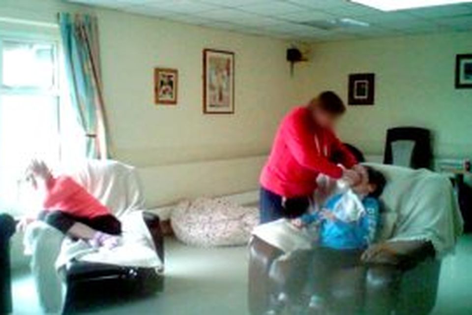 A resident of Aras Attracta residential care centre being force-fed by a staff member