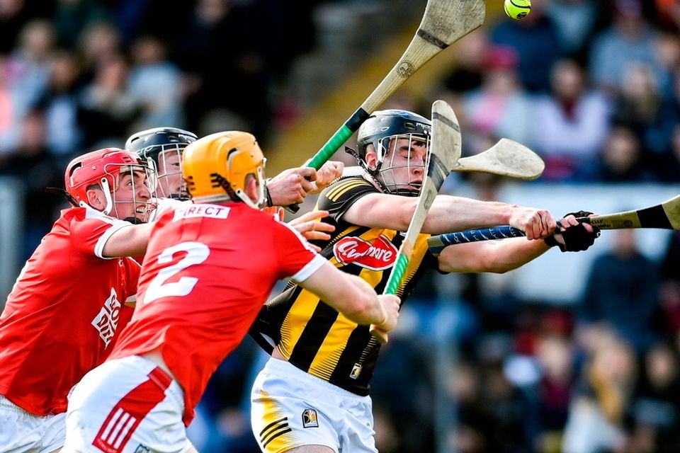 Billy Drennan of Kilkenny is tackled by Cork players, from left, Damien Cahalane, Ciarán Joyce and Niall O’Leary