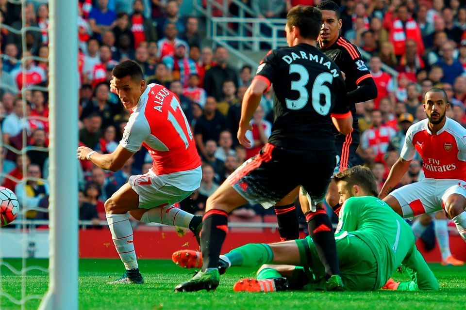 Alexis Sanchez puts Arsenal ahead against Manchester United with a deft flick of his right boot at the Emirates GETTY