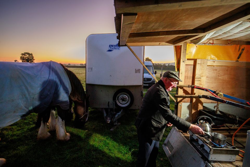 Colman Cogan from Sligo making breakfast during sunrise on day two of  the National Ploughing Championships in Ratheniska. Pic: Mark Condren