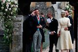 thumbnail: Spencer Matthews (left), the brother of groom James Matthews, 
stands at the entrance of St Mark's Church in Englefield, ahead of his brother's wedding to Pippa Middleton
