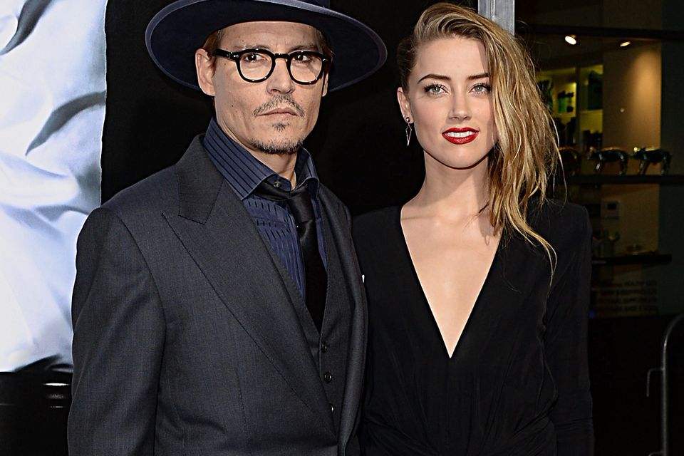 Actors Johnny Depp and Amber Heard together in 2014. Photo: Jason Merritt/Getty Images