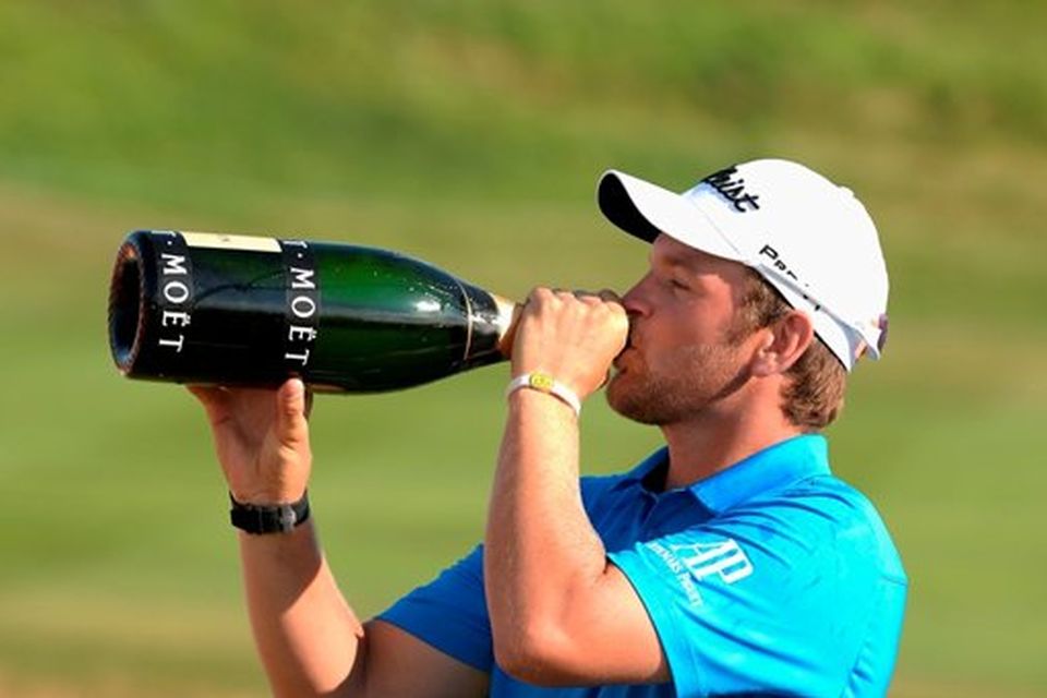 PARIS, FRANCE - JULY 05: Bernd Wiesberger of Austria celebrates his win with some champagne during the Alstom Open de France - Day Four at Le Golf National on July 5, 2015 in Paris, France. (Photo by Tony Marshall/Getty Images)